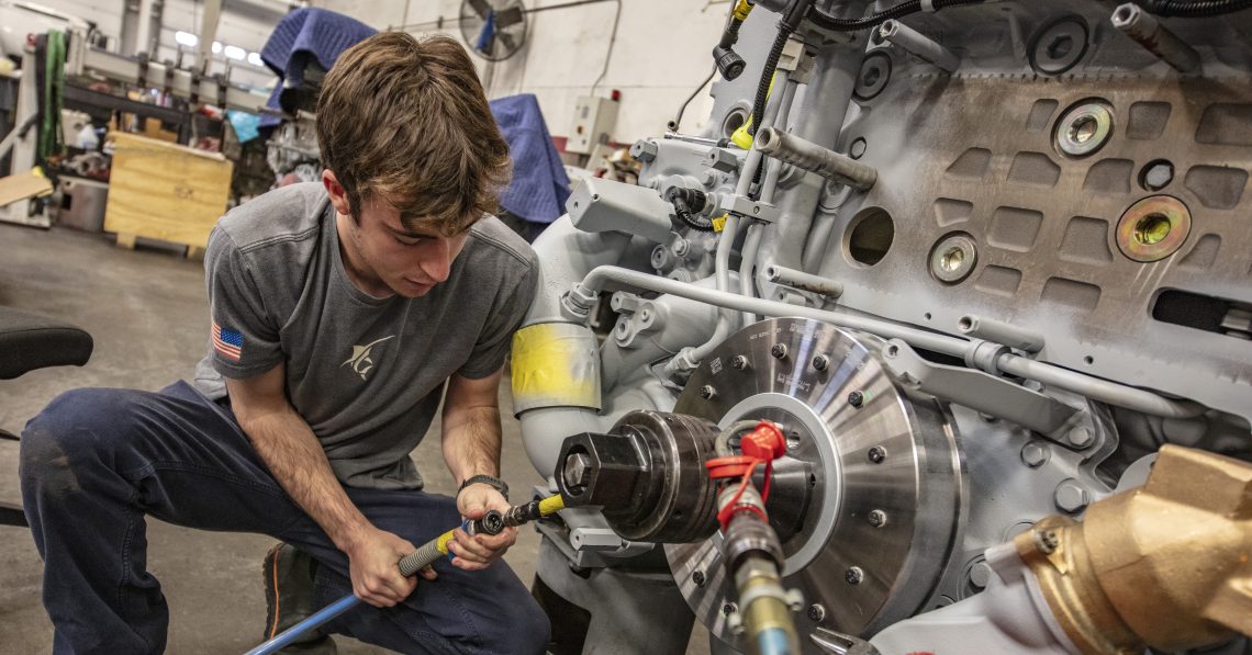 technician working on a marine engine